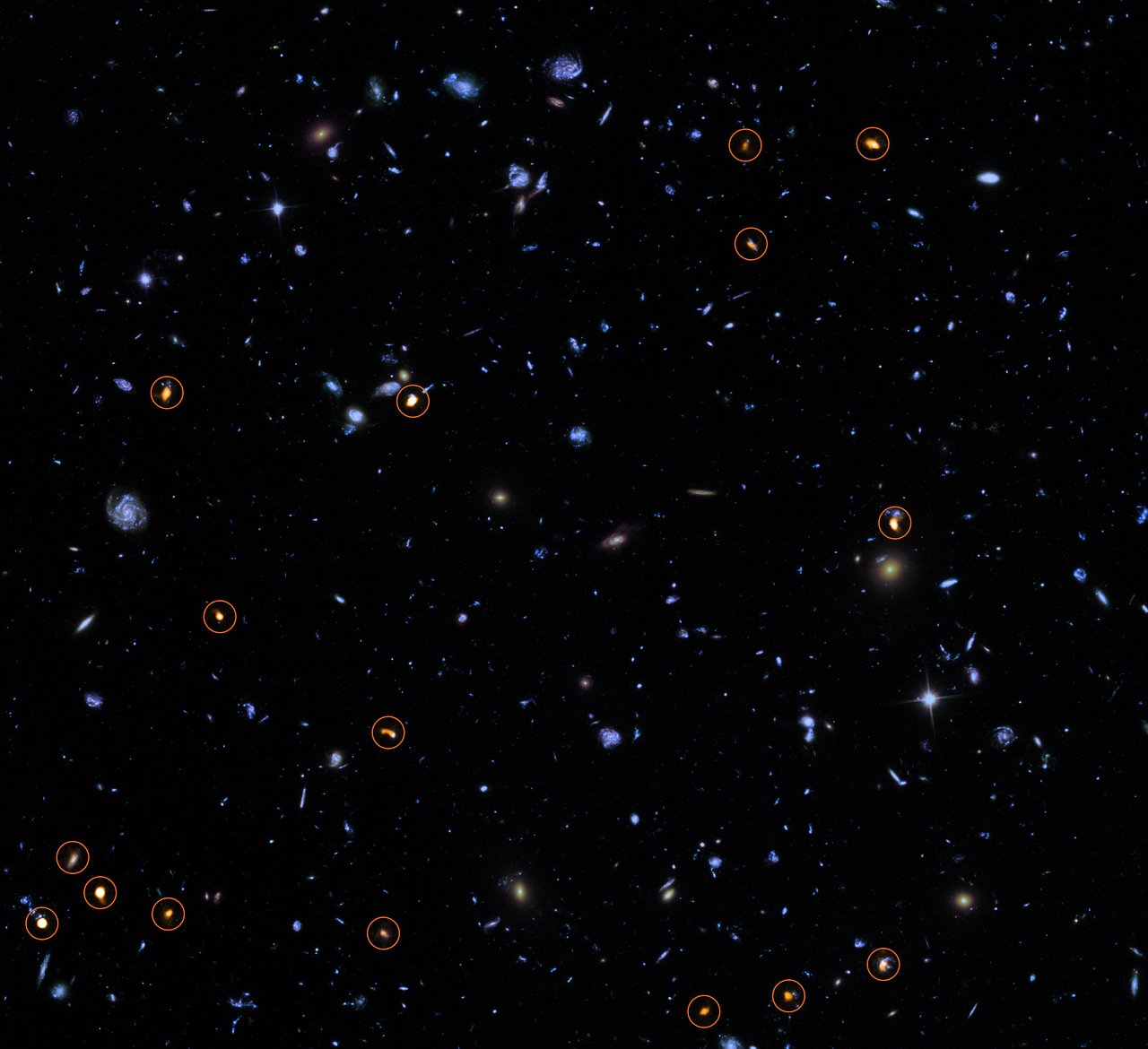 This image combines a background picture taken by the NASA/ESA Hubble Space Telescope (blue/green) with a new very deep ALMA view of this field (orange, marked with circles). All the objects that ALMA sees appear to be massive star-forming galaxies. This image is based on the ALMA survey by J. Dunlop and colleagues, covering the full HUDF area.