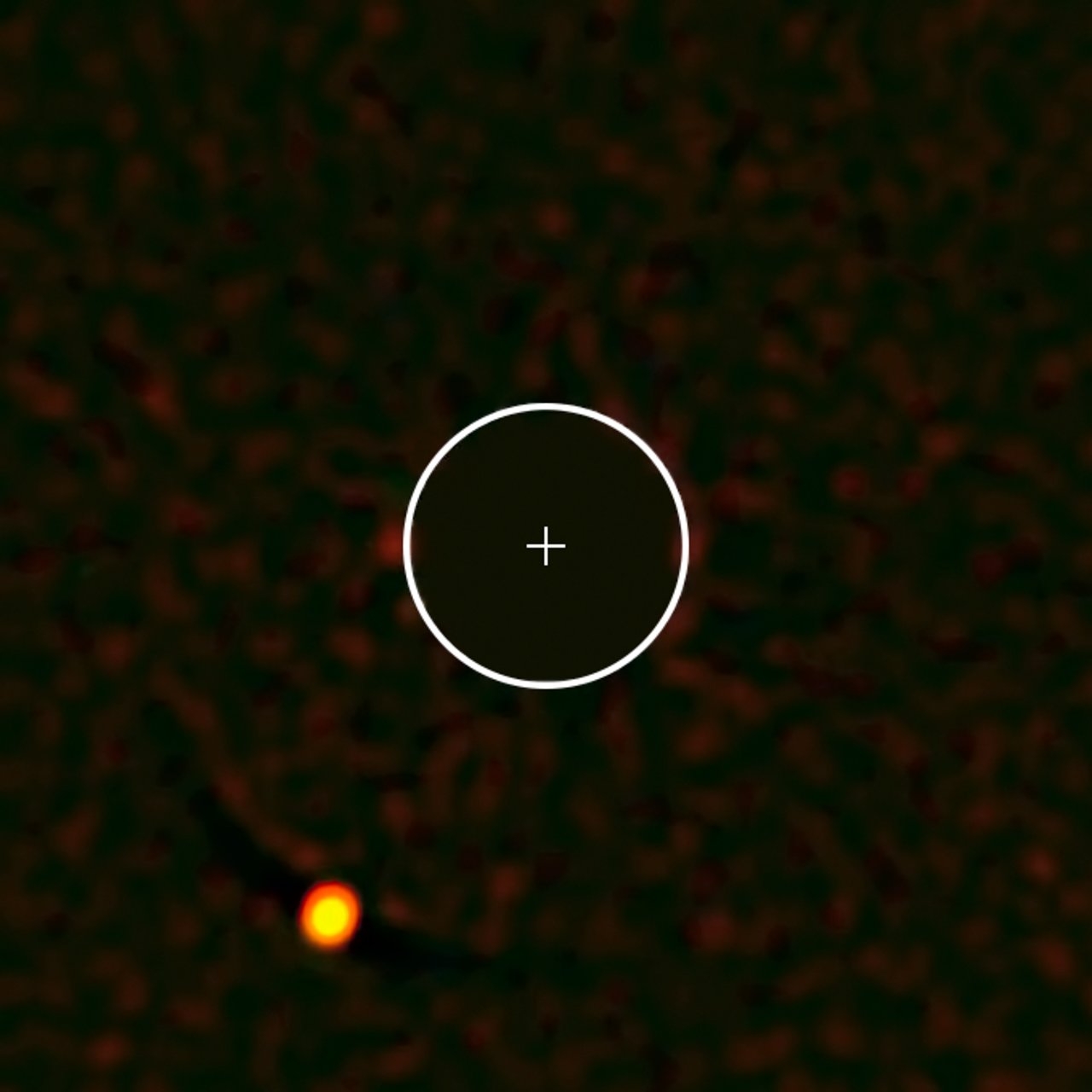 The exoplanet HIP 65426b — the first to be seen by the SPHERE instrument on ESO’s Very Large Telescope. The image of the parent star has been removed from the image for clarity, and its position marked with a cross; the circle indicates the orbit of Neptune around the Sun on the same scale. The planet is clearly visible at the lower-left in this remarkable image.