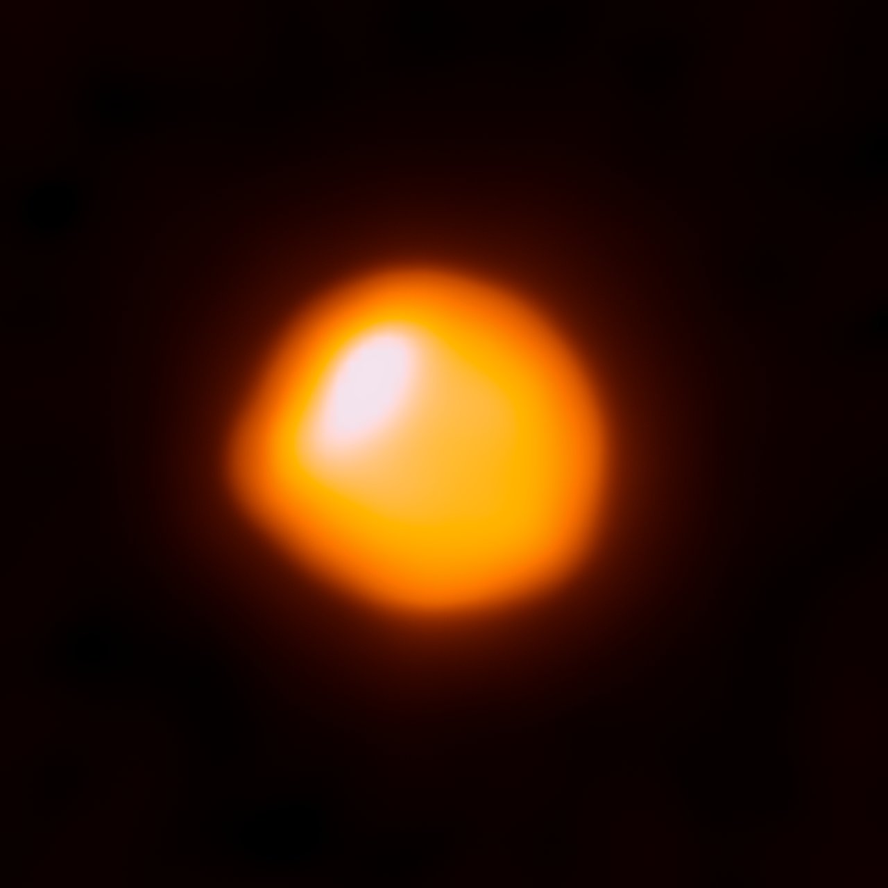 This orange blob shows the nearby star Betelgeuse, as seen by the Atacama Large Millimeter/submillimeter Array (ALMA). This is the first time that ALMA has ever observed the surface of a star and this first attempt has resulted in the highest-resolution image of Betelgeuse available. Betelgeuse is one of the largest stars currently known — with a radius around 1400 times larger than the Sun’s in the millimeter continuum. About 600 light-years away in the constellation of Orion (The Hunter), the red supergiant burns brightly, causing it to have only a short life expectancy. The star is just about eight million years old, but is already on the verge of becoming a supernova. When that happens, the resulting explosion will be visible from Earth, even in broad daylight. The star has been observed in many other wavelengths, particularly in the visible, infrared, and ultraviolet. Using ESO’s Very Large Telescope astronomers discovered a vast plume of gas almost as large as our Solar System. Astronomers have also found a gigantic bubble that boils away on Betelgeuse’s surface. These features help to explain how the star is shedding gas and dust at tremendous rates (eso0927, eso1121). In this picture, ALMA observes the hot gas of the photosphere of Betelgeuse at sub-millimeter wavelengths — where localised increased temperatures explain why it is not symmetric. Scientifically, ALMA can help us to understand the extended atmospheres of these hot, blazing stars. Links:  Size comparison: Betelgeuse and the Sun